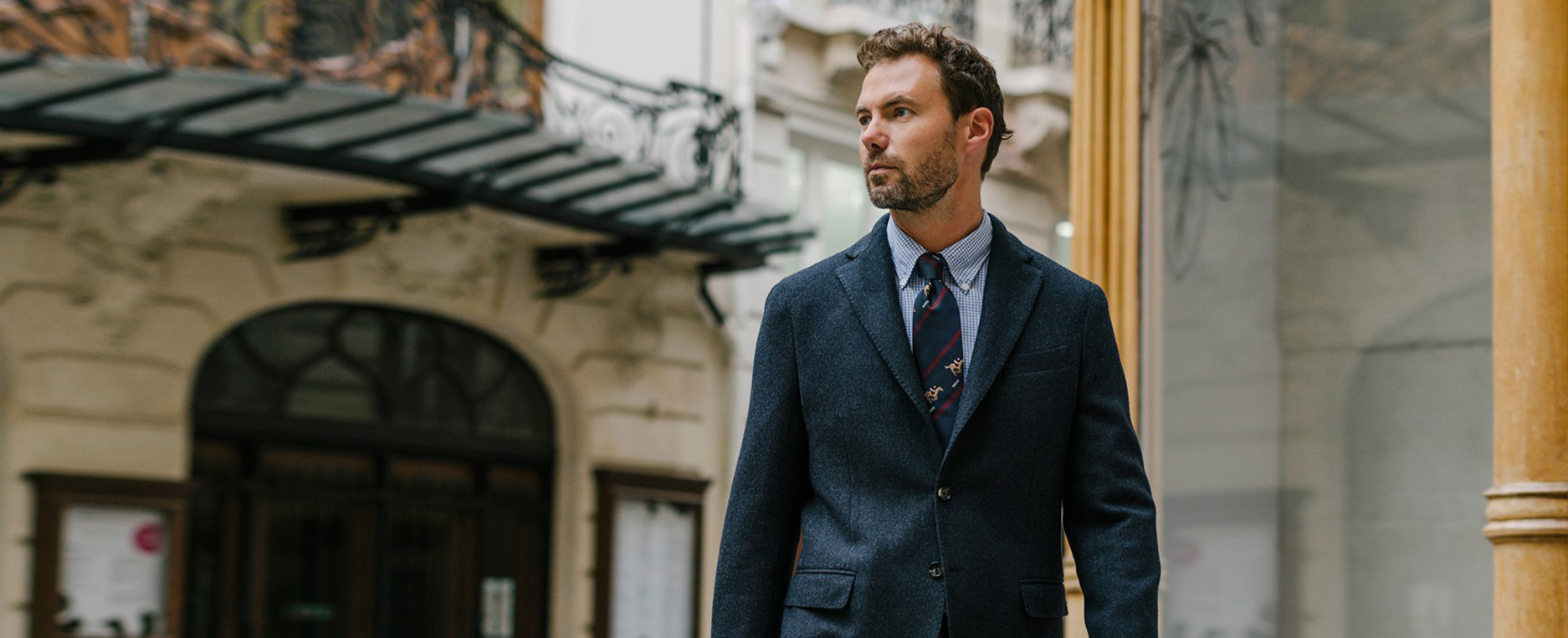 Man in suit walking outside